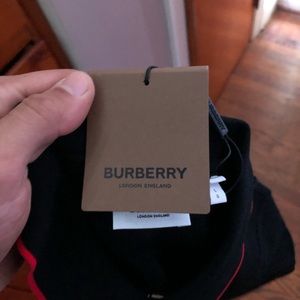 NEVER WORN Burberry stripe placket polo with tags.